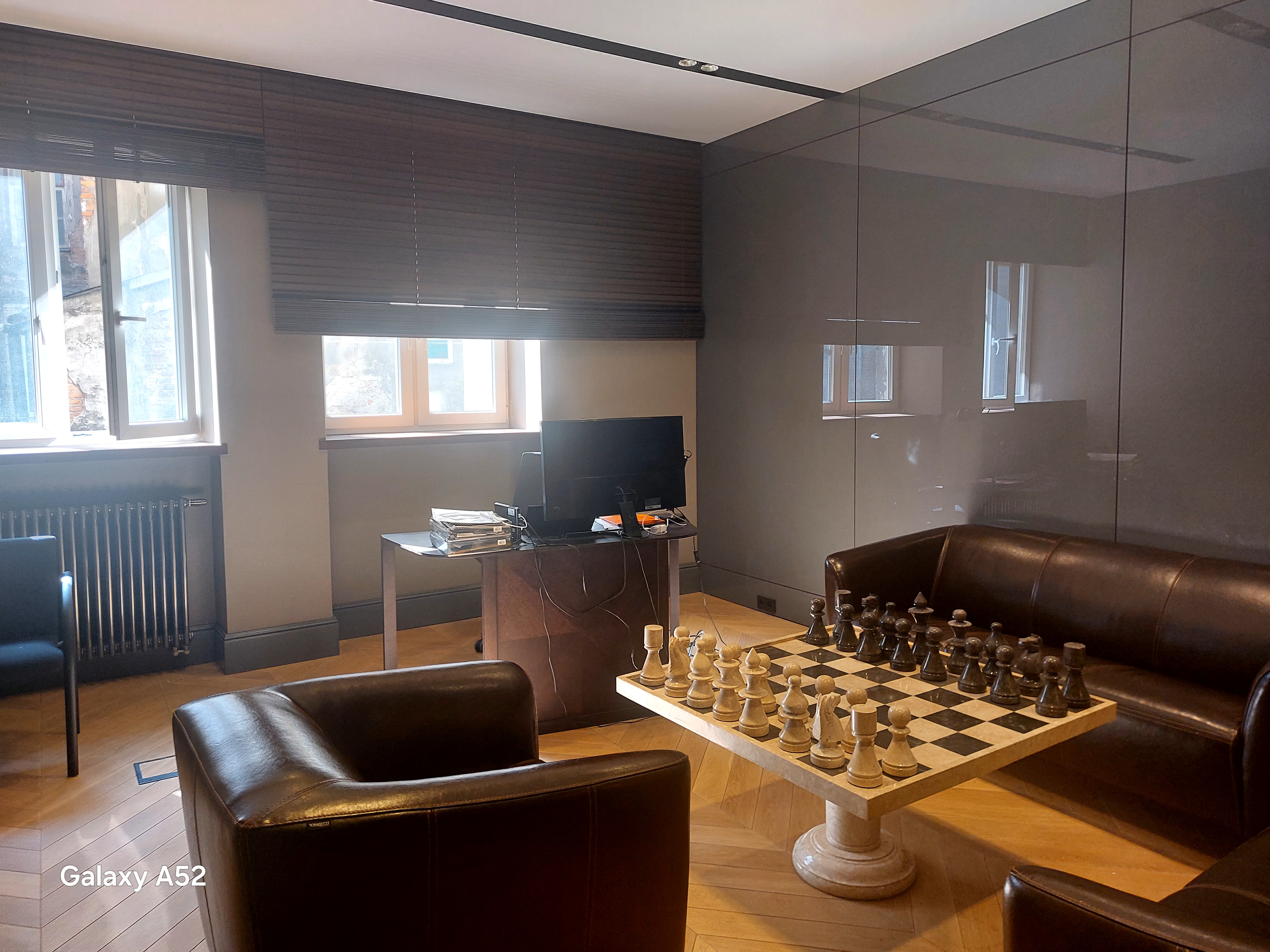 Interior of W15 Warsaw — high‑ceiling ground‑floor unit